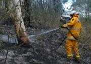 A firefighter mops up at Norton Summit